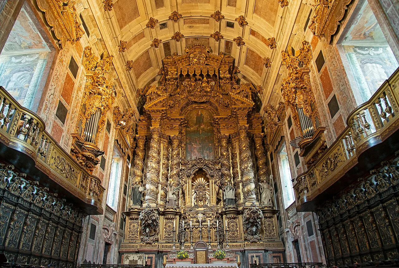 Gilded altar and carved choir stalls inside Porto Cathedral
