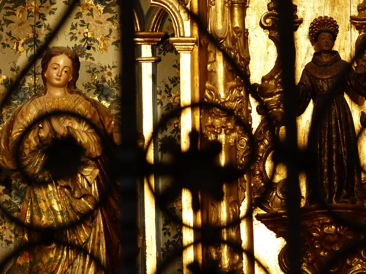 Carved figures and gilded decoration inside Osuna's Colegiata