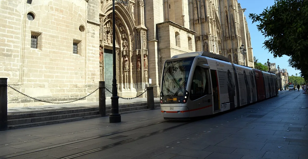 Historical MetroCentro tram beside Seville Cathedral, separate from Metro Line 1